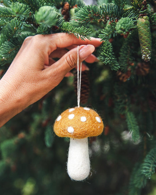 Farmhouse Pottery felted mushroom ornament in ochre.