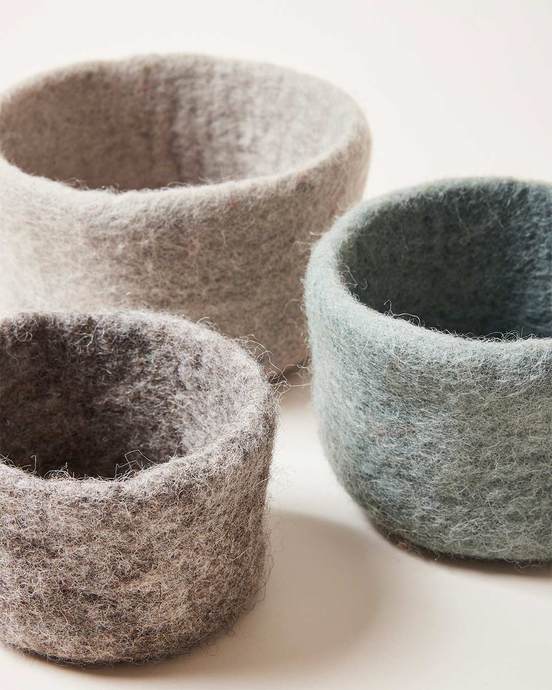 Farmhouse Pottery artisan felt nesting bowls various sizes and colors. 