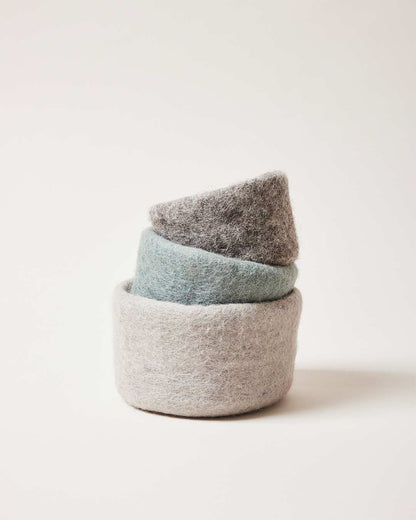 Farmhouse Pottery felt nesting bowls stacked various sizes and colors. 