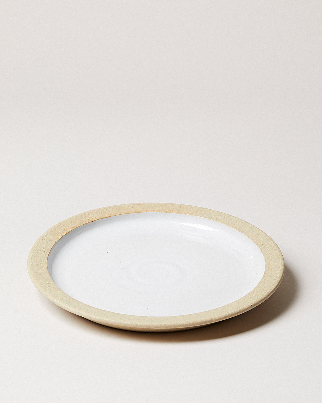 Farmhouse Pottery dinnerware plate on a white background.