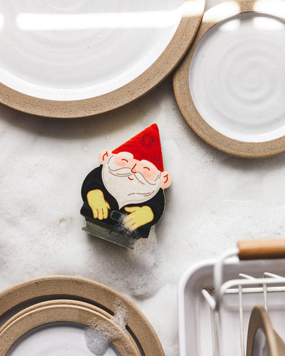 Farmhouse Pottery gnome sponge on countertop. 