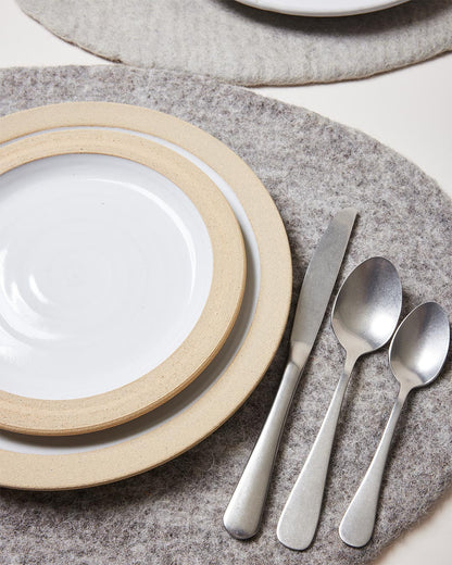 Farmhouse Pottery artisan felt placemats pebble grey with dinner setting. 