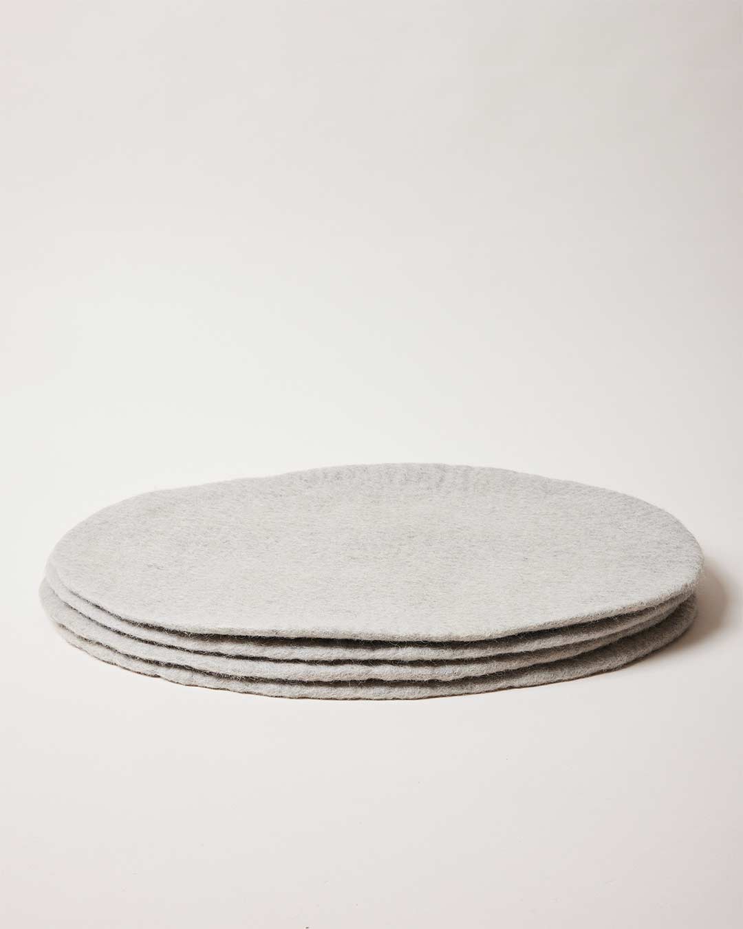 Farmhouse Pottery artisan felt placemats stone. 