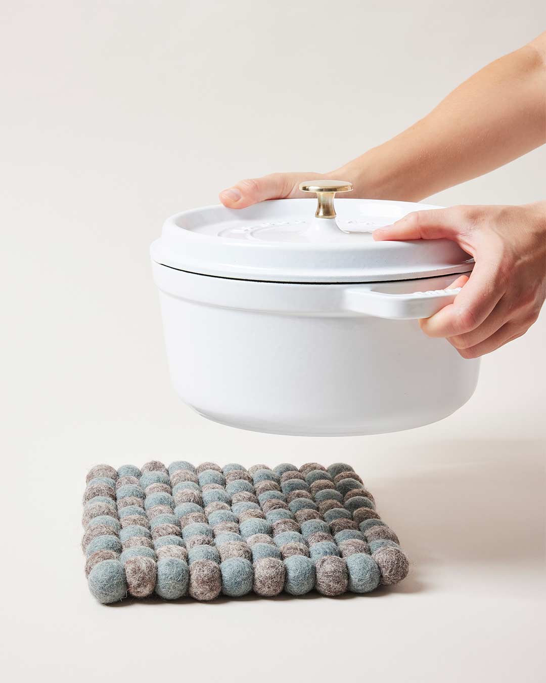Farmhouse Pottery artisan felt pom pom trivet teal and pebble grey. 