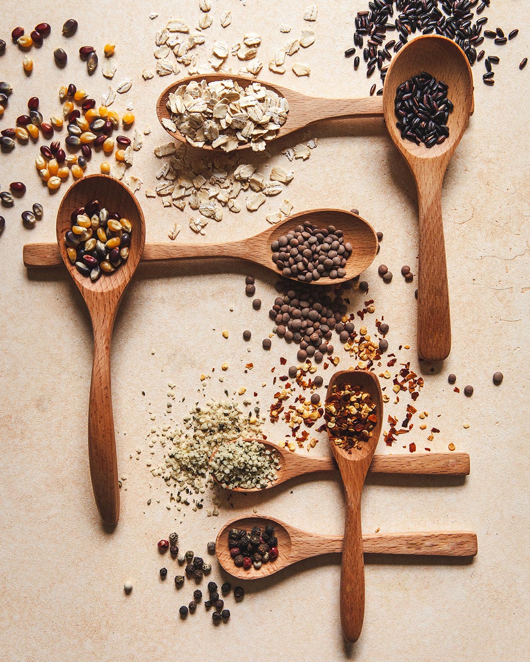 Farmhouse Pottery essential kitchen little spoon set of 7 shown with herbs and spices. 