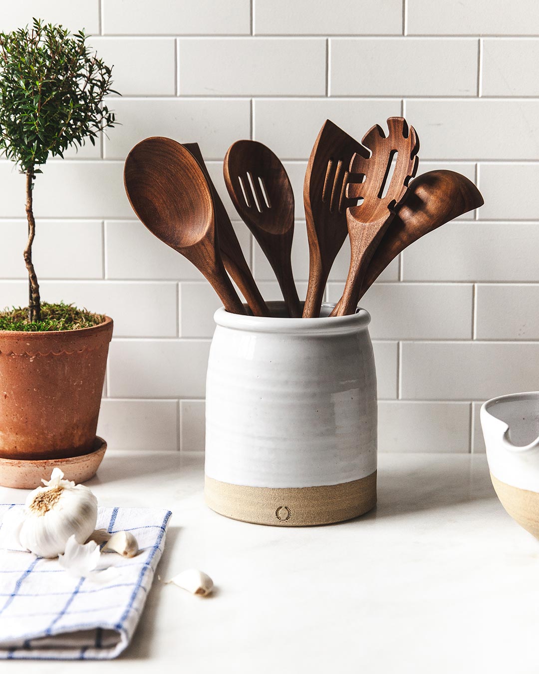 Farmhouse Pottery essential kitchen utensil set of 6 in walnut shown in beehive crock. 