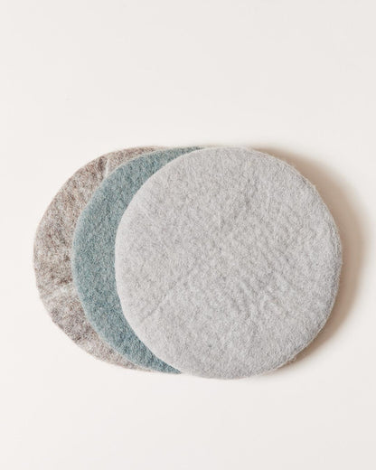 Farmhouse Pottery felt hot pads in pebble gray, stone and teal. 