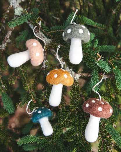 Farmhouse Pottery felted mushroom ornaments in all colors on christmas tree.