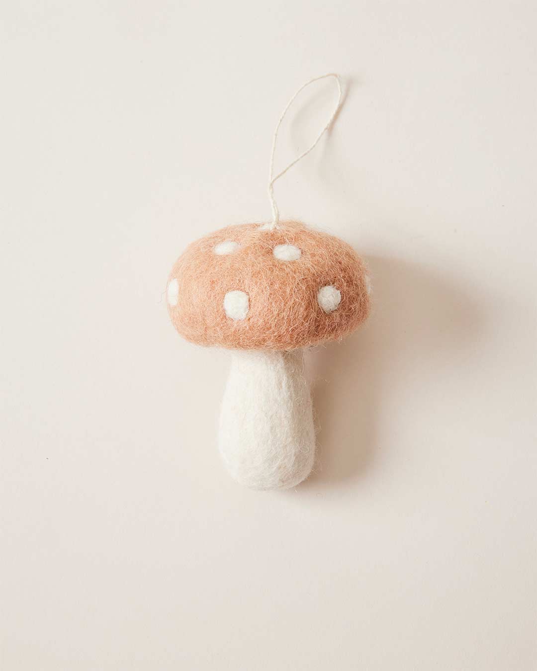 Farmhouse Pottery felted mushroom ornament in blush. 