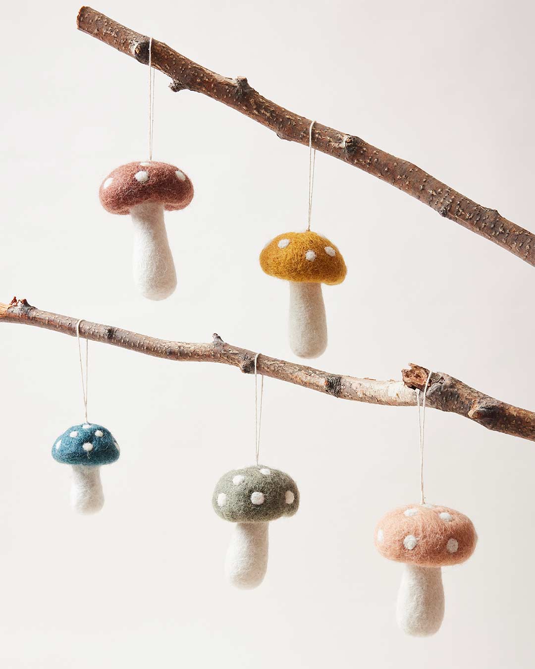Farmhouse Pottery felted mushroom ornaments in five colors. 