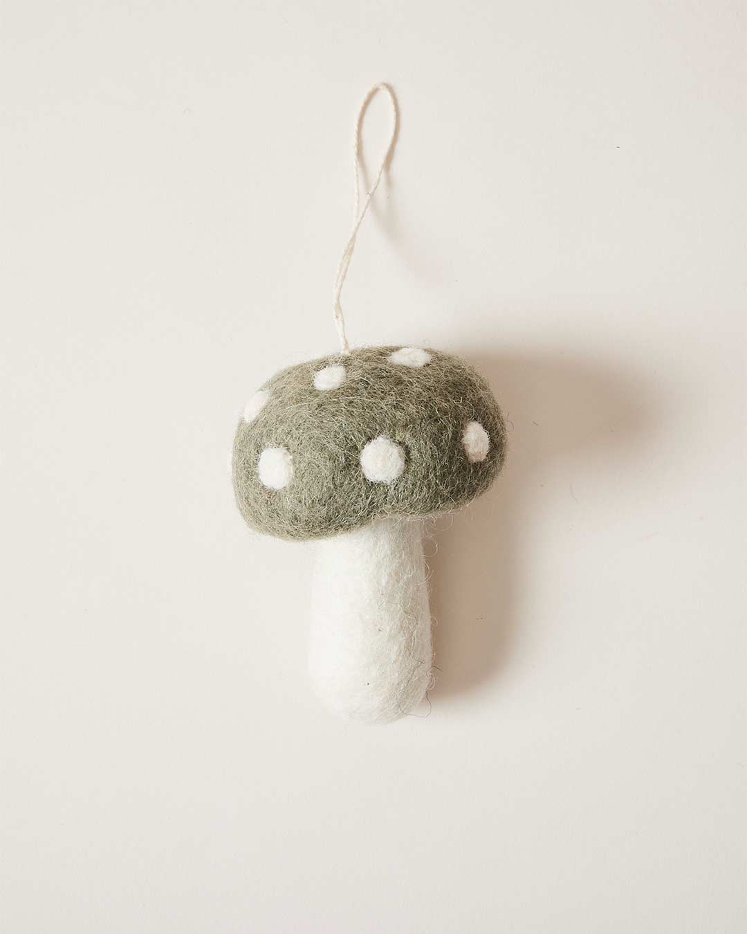 Farmhouse Pottery felted mushroom ornament in moss. 