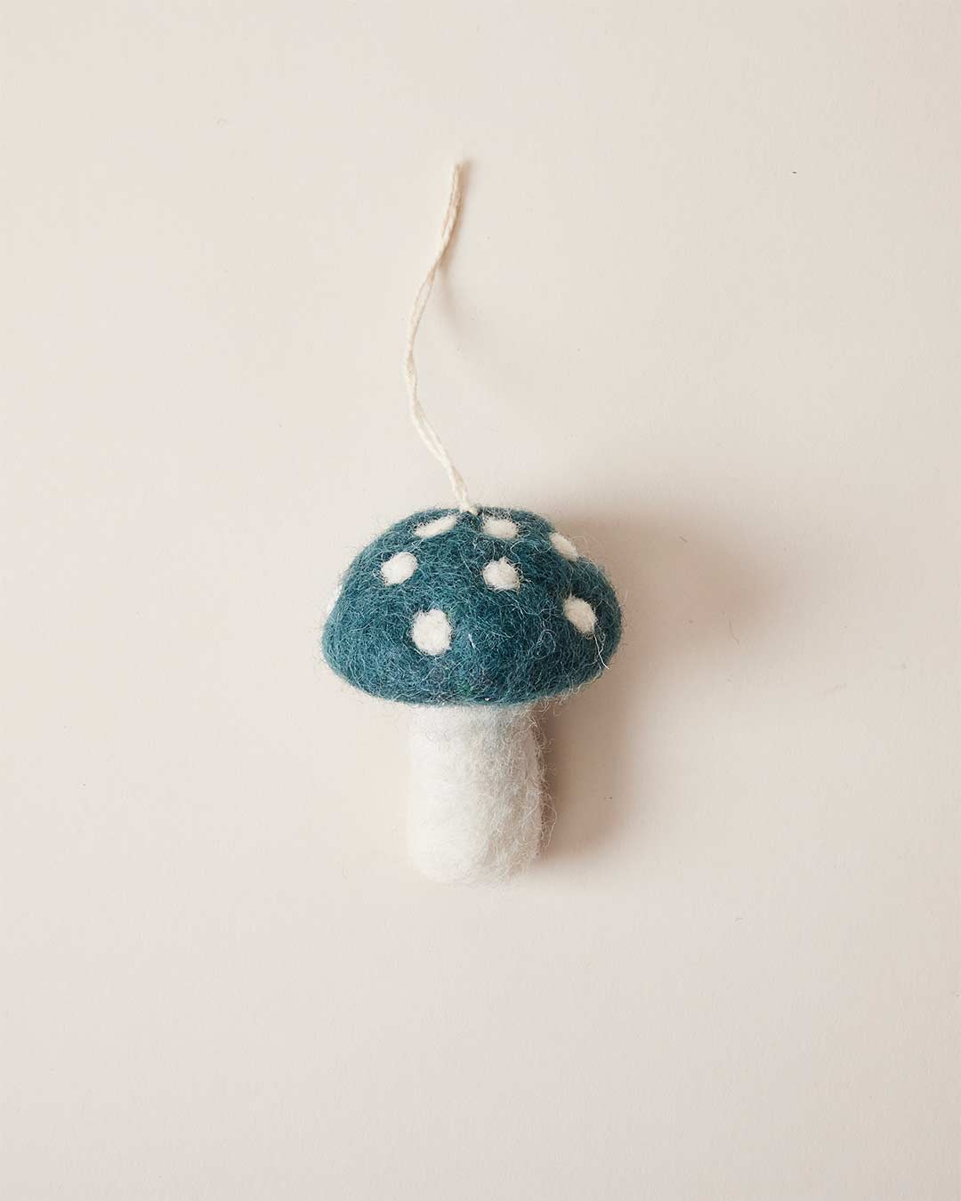 Farmhouse pottery felted mushroom ornament in teal. 