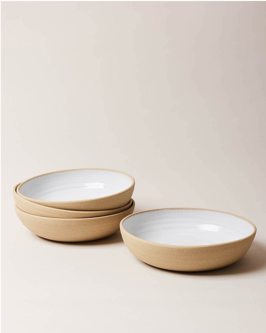 Farmhouse Pottery Harvest Bowl Large set of 4 with a light cream background.