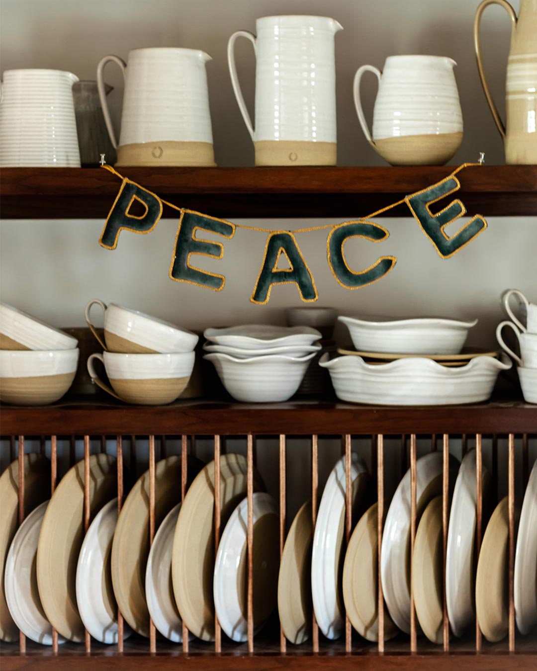 Farmhouse Pottery velvet holiday greeting peace hanging in pantry. 