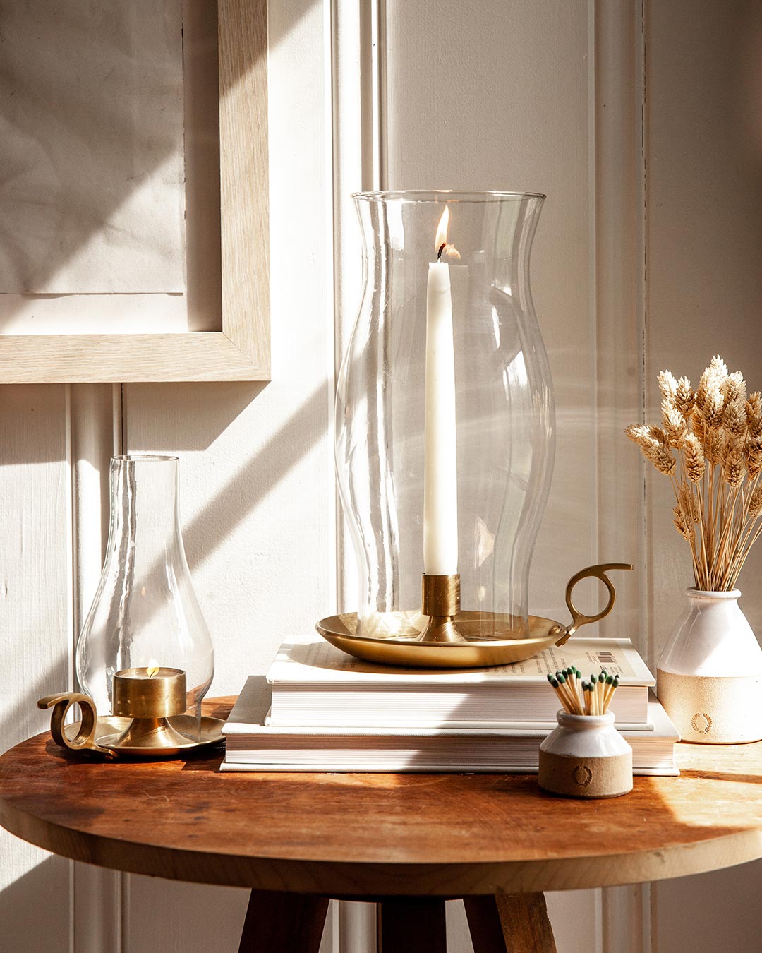Farmhouse Pottery windsor lantern and windsor hurricane on table. 